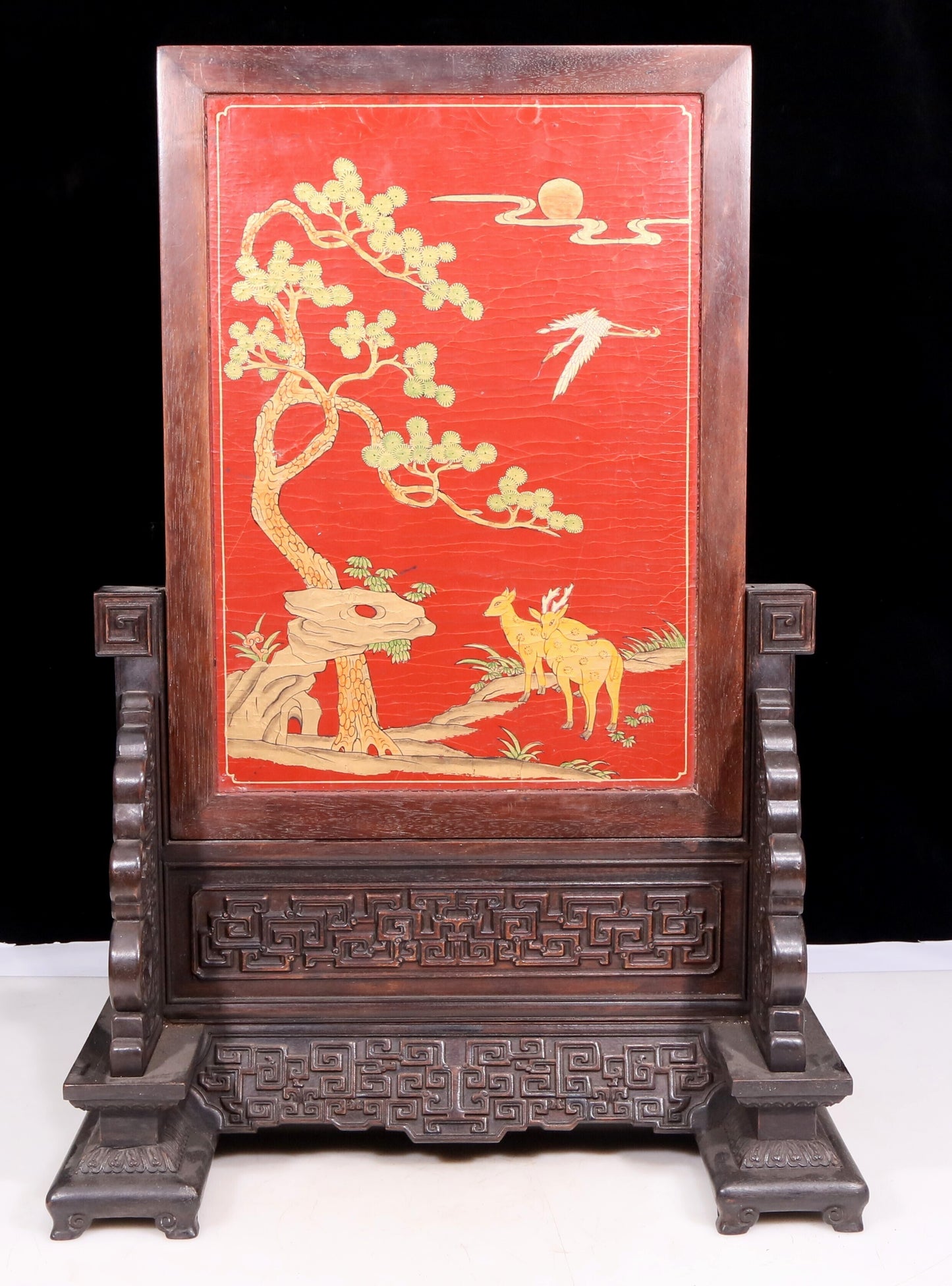 An exquisite zitanwood lacquered and gold-embedded pine and crane pattern table screen