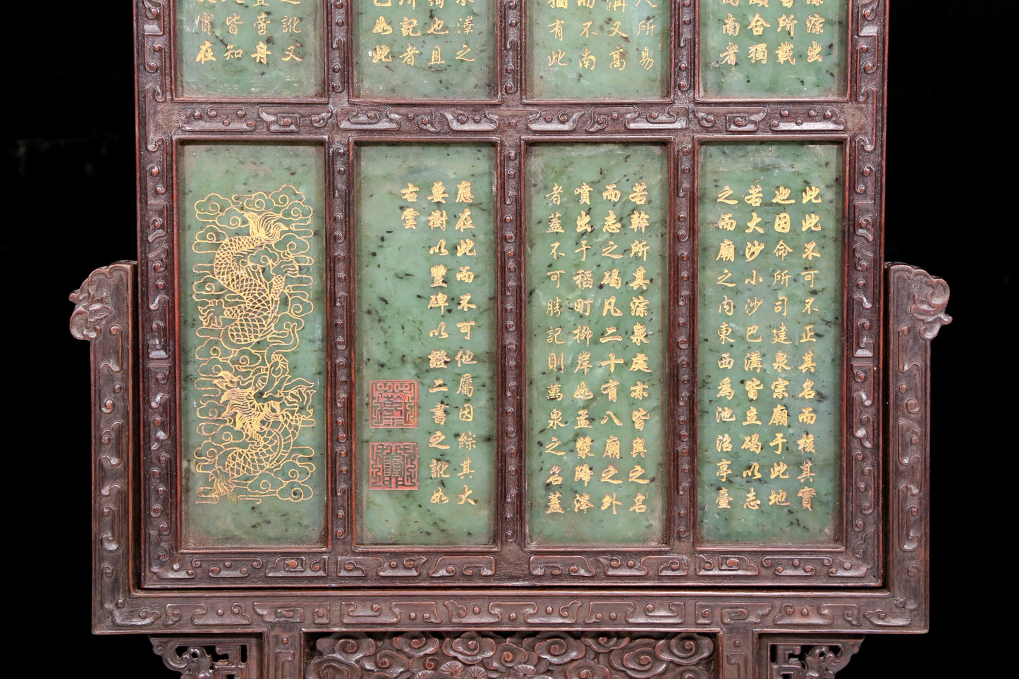 An exquisite zitanwood table screen inlaid with jasper dragon patterns