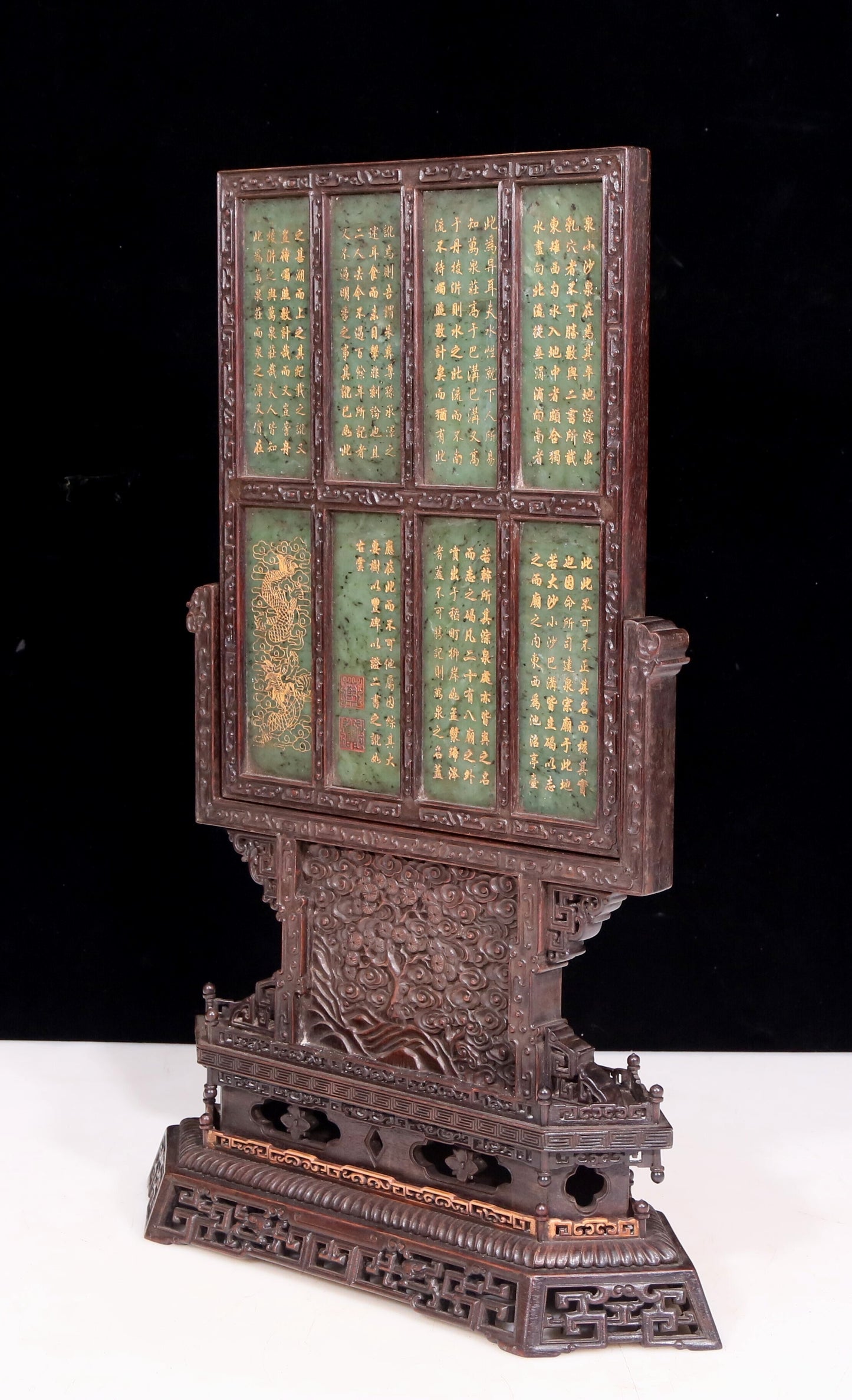 An exquisite zitanwood table screen inlaid with jasper dragon patterns