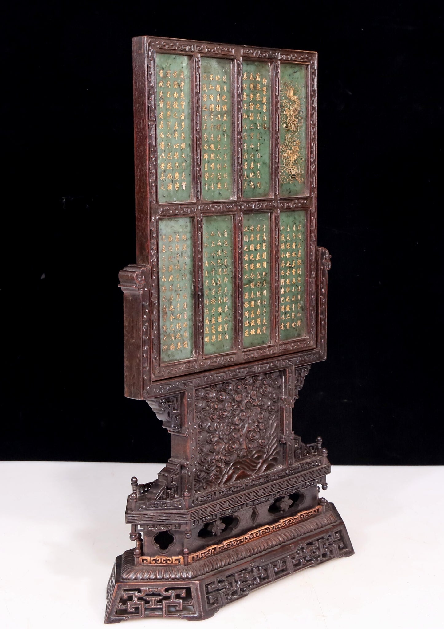 An exquisite zitanwood table screen inlaid with jasper dragon patterns