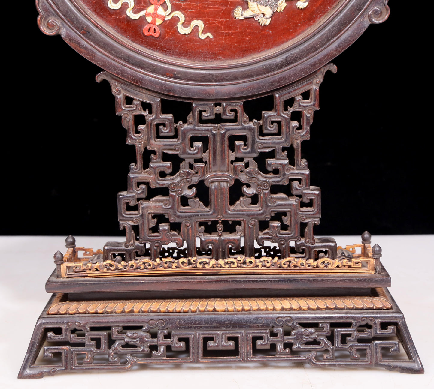 An exquisite zitanwood lacquered and gold-embedded table screen with a lion opera pattern.