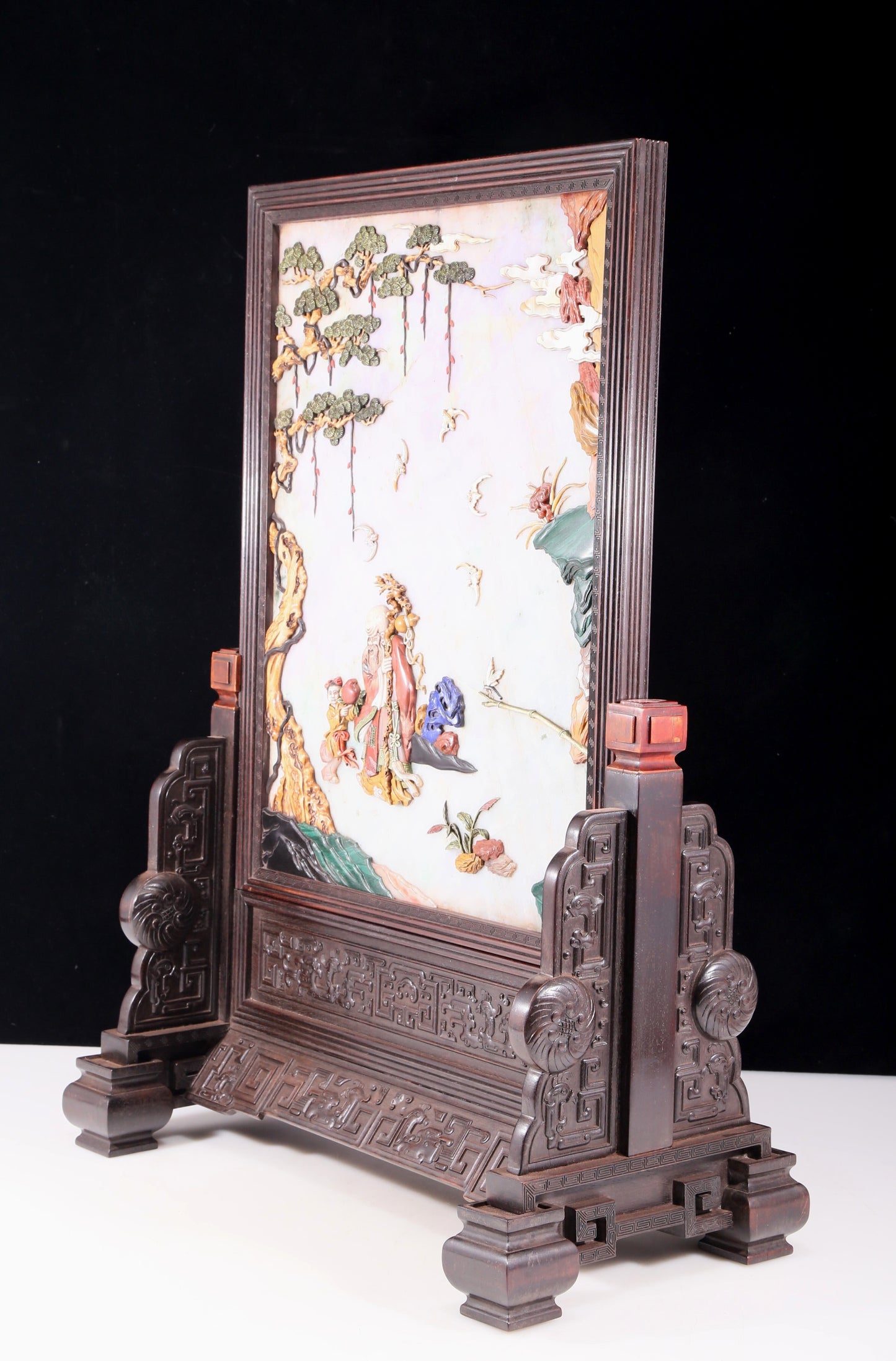 An exquisite zitanwood lacquered, gold-embedded, character-patterned table screen