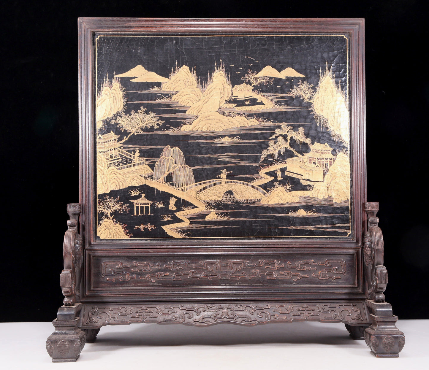 An exquisite zitanwood lacquered, gold-embedded, character-patterned table screen