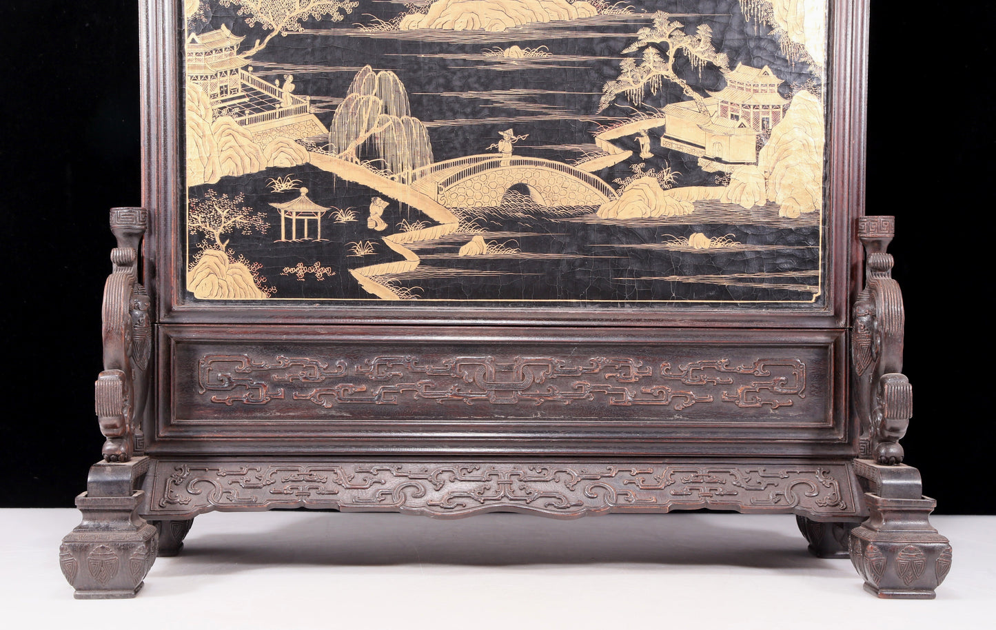 An exquisite zitanwood lacquered, gold-embedded, character-patterned table screen