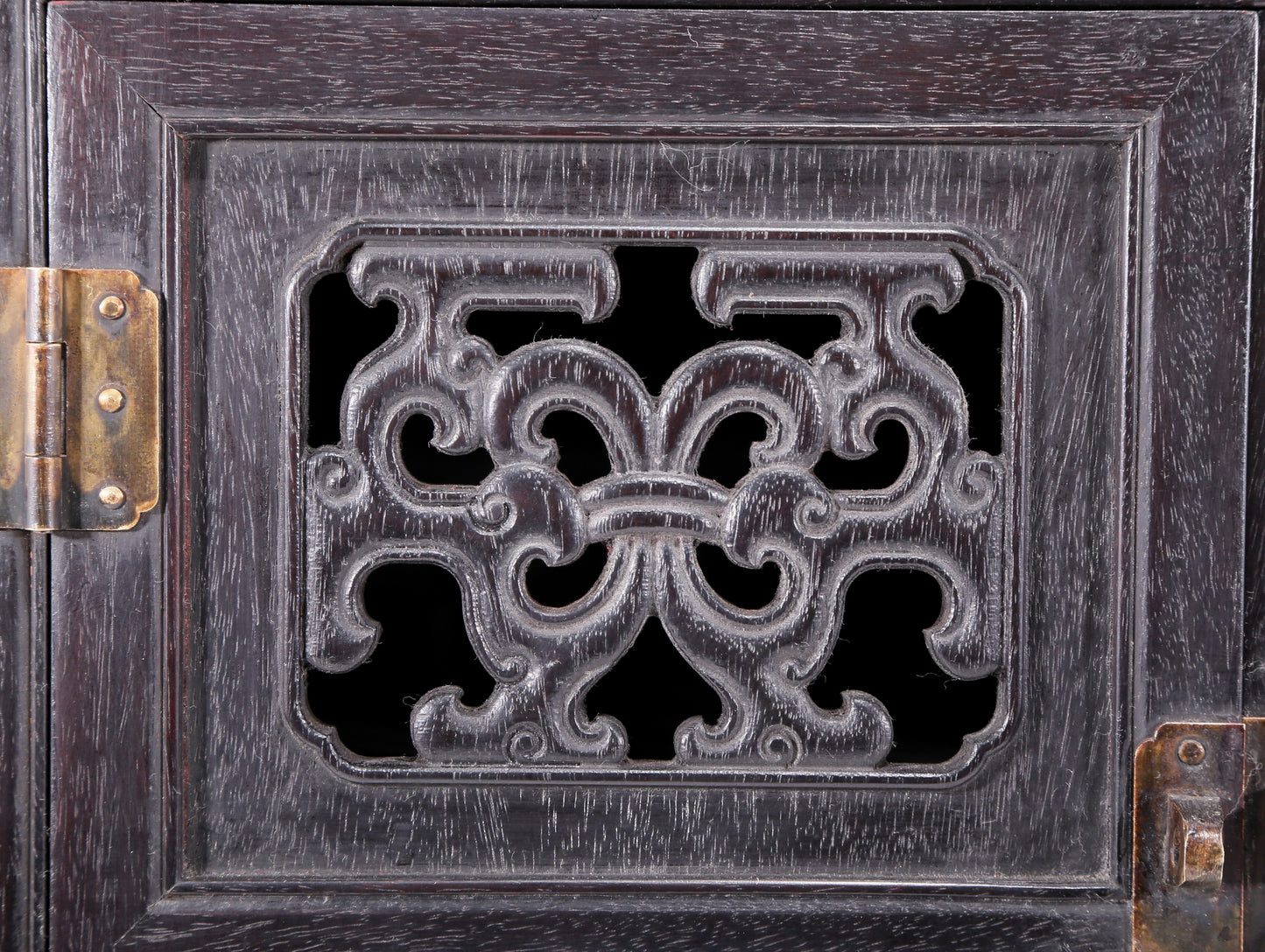 An exquisite zitanwood cabinet inlaid with gems and patterns of fortune, wealth, longevity and happiness