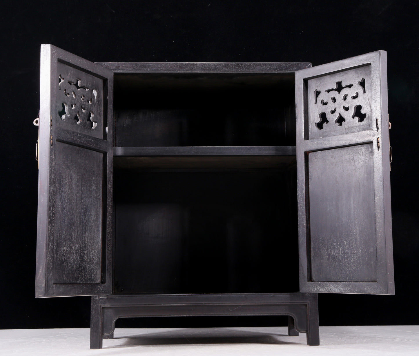 An exquisite zitanwood cabinet inlaid with gems and patterns of fortune, wealth, longevity and happiness