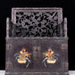 An exquisite zitanwood cabinet with inlaid gemstones and flower and bird patterns