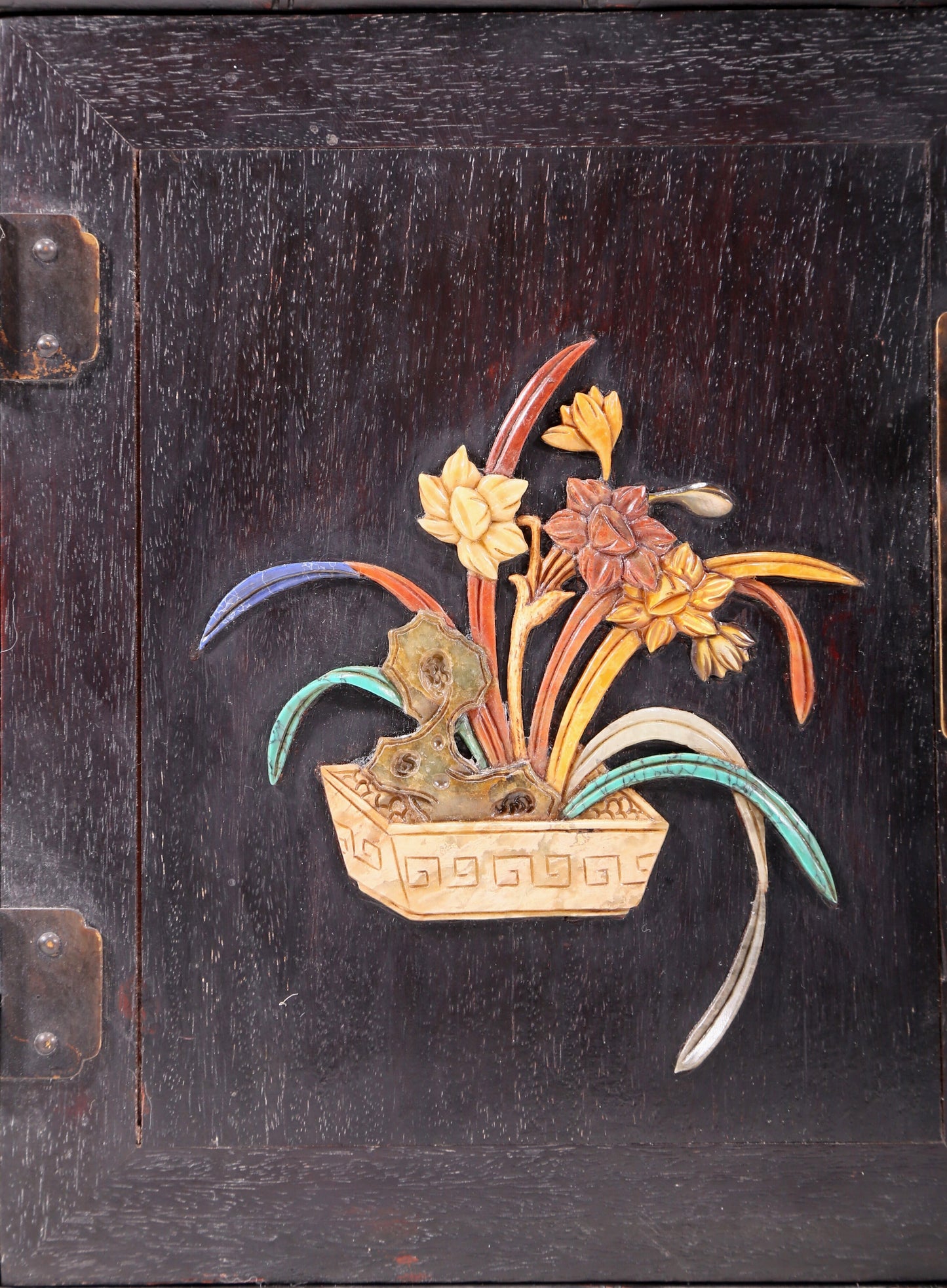 An exquisite zitanwood cabinet with inlaid gemstones and flower and bird patterns