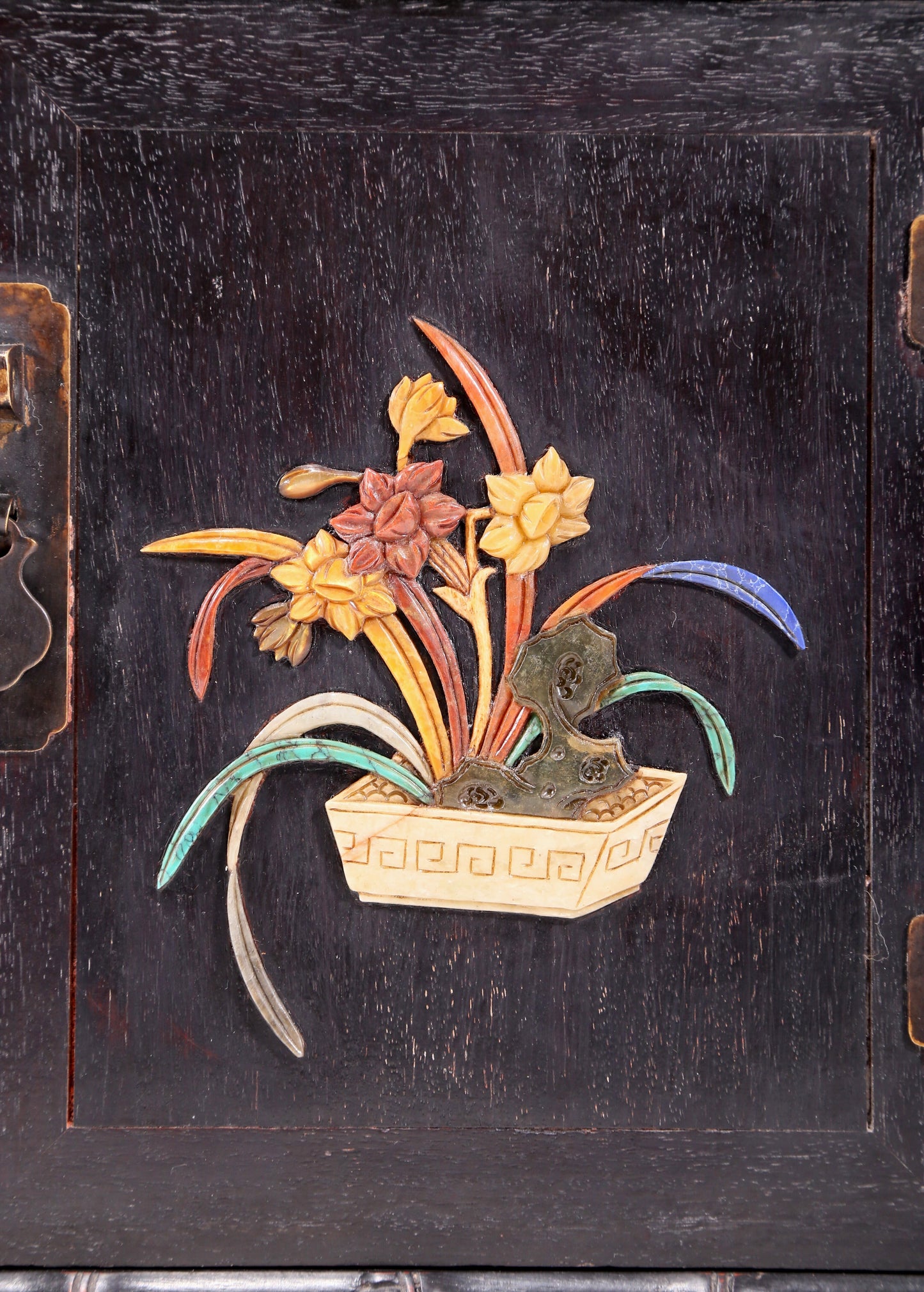 An exquisite zitanwood cabinet with inlaid gemstones and flower and bird patterns