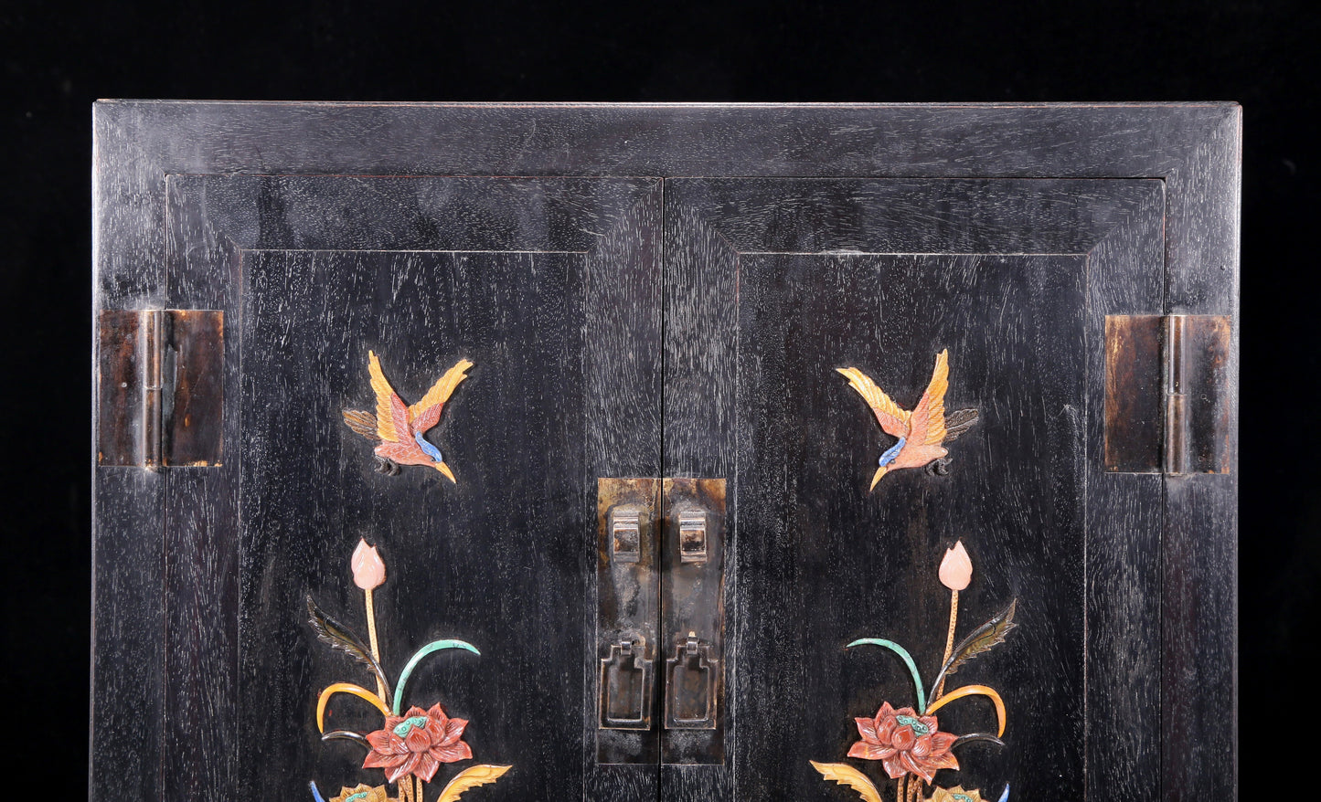 An exquisite zitanwood cabinet with inlaid gemstones and flower and bird patterns