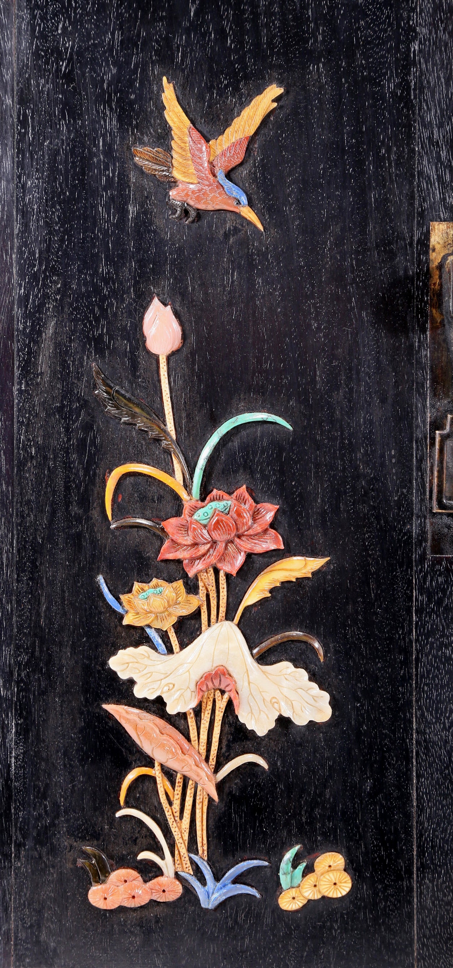 An exquisite zitanwood cabinet with inlaid gemstones and flower and bird patterns