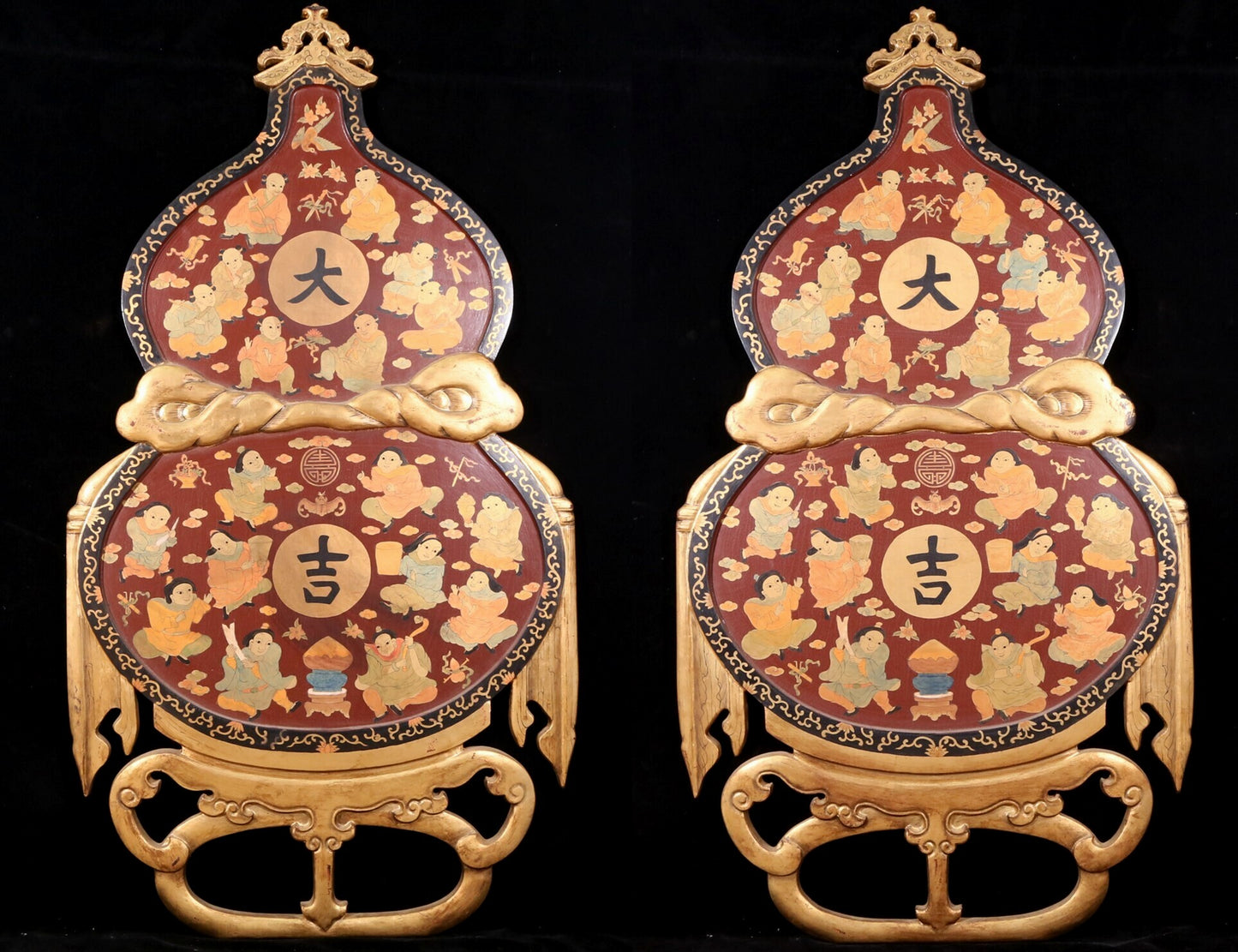 A pair of exquisite zitanwood painted figures with festive patterns and gourd hanging screens