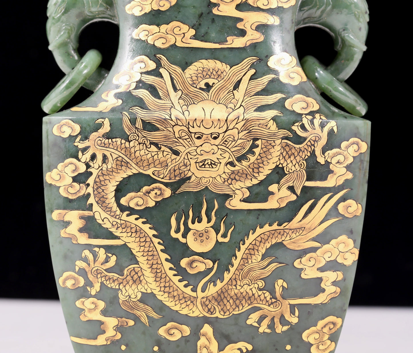 A perfect jasper bottle with golden dragon pattern and elephant ear cap