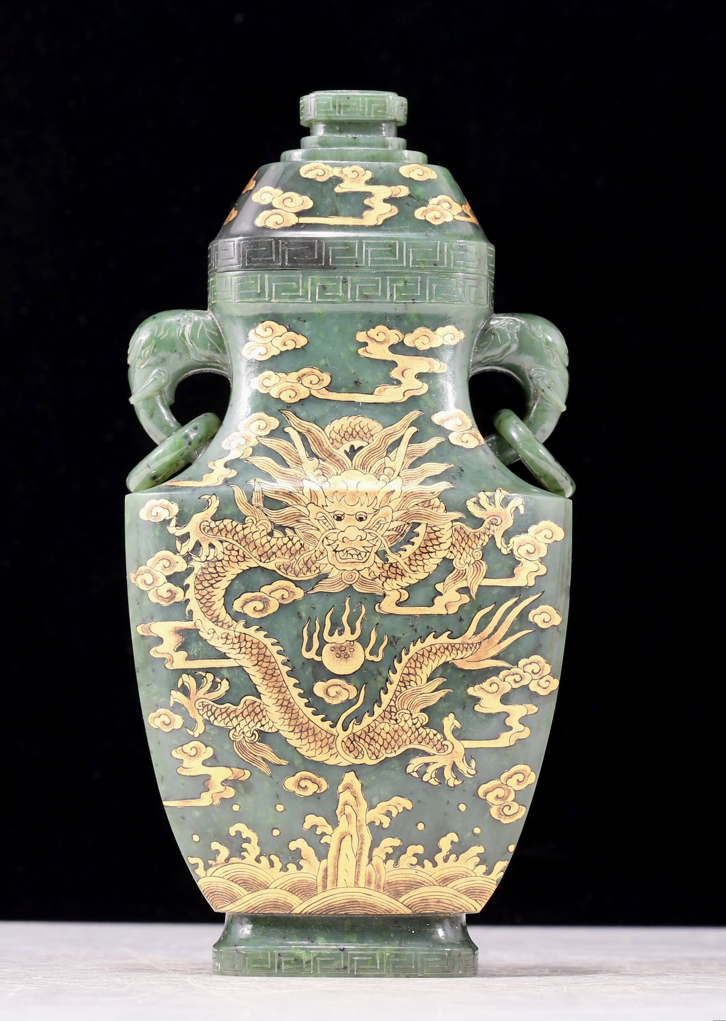 A perfect jasper bottle with golden dragon pattern and elephant ear cap