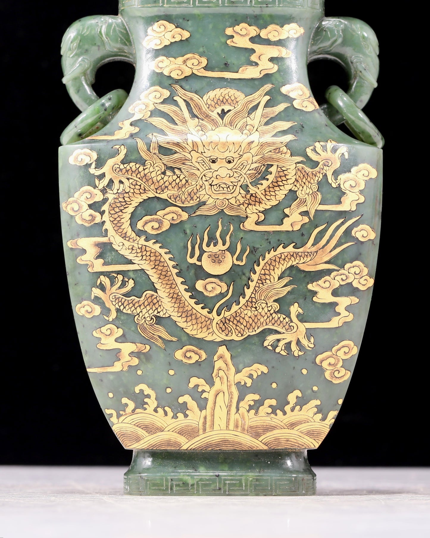 A perfect jasper bottle with golden dragon pattern and elephant ear cap