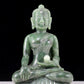 A solemn gilt bronze and gem-set jasper statue of Gautama Buddha