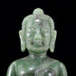 A solemn gilt bronze and gem-set jasper statue of Gautama Buddha