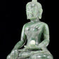 A solemn gilt bronze and gem-set jasper statue of Gautama Buddha