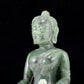 A solemn gilt bronze and gem-set jasper statue of Gautama Buddha