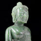 A solemn gilt bronze and gem-set jasper statue of Gautama Buddha