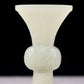 An exquisite white jade bottle with animal mask pattern