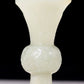 An exquisite white jade bottle with animal mask pattern