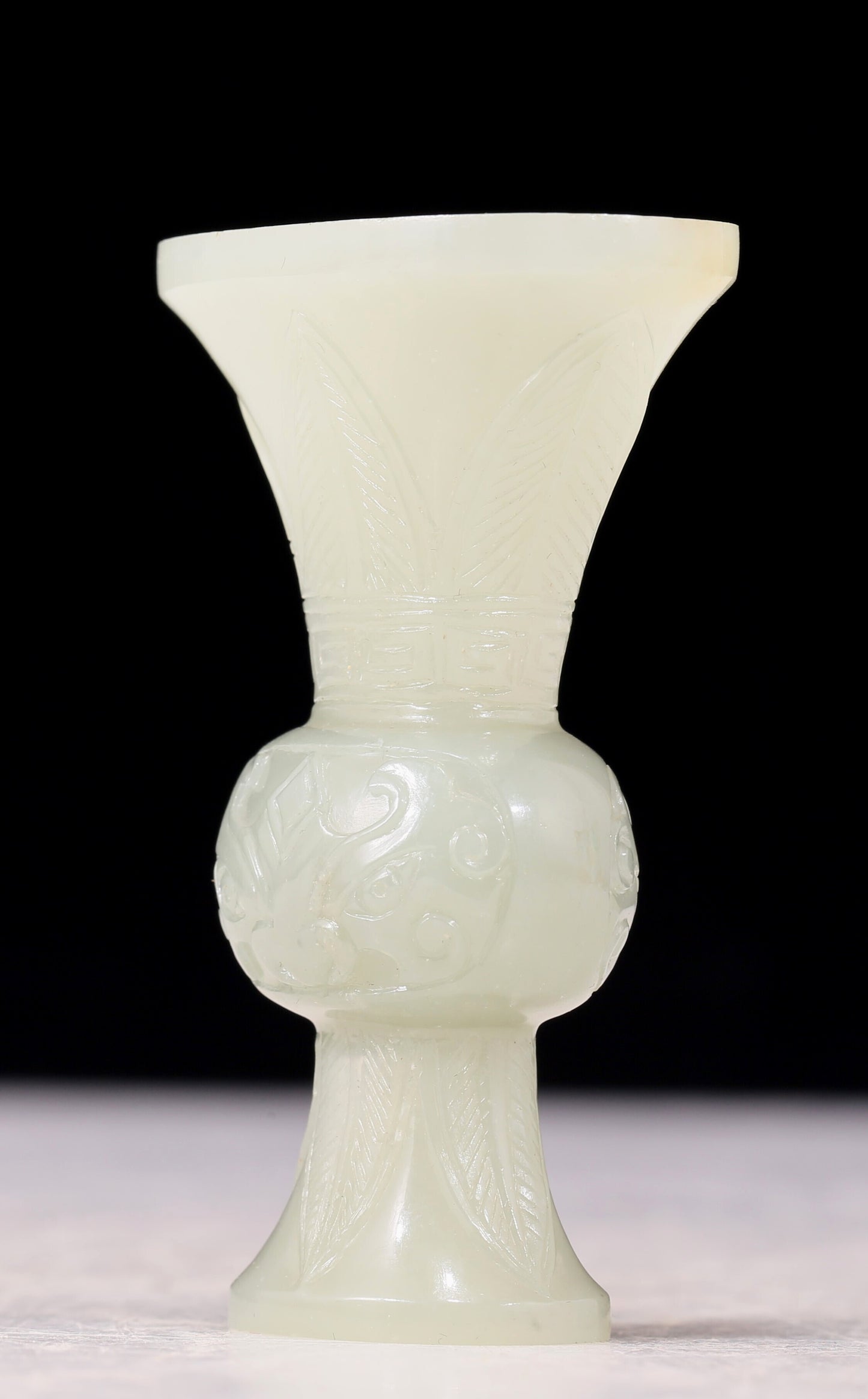 An exquisite white jade bottle with animal mask pattern