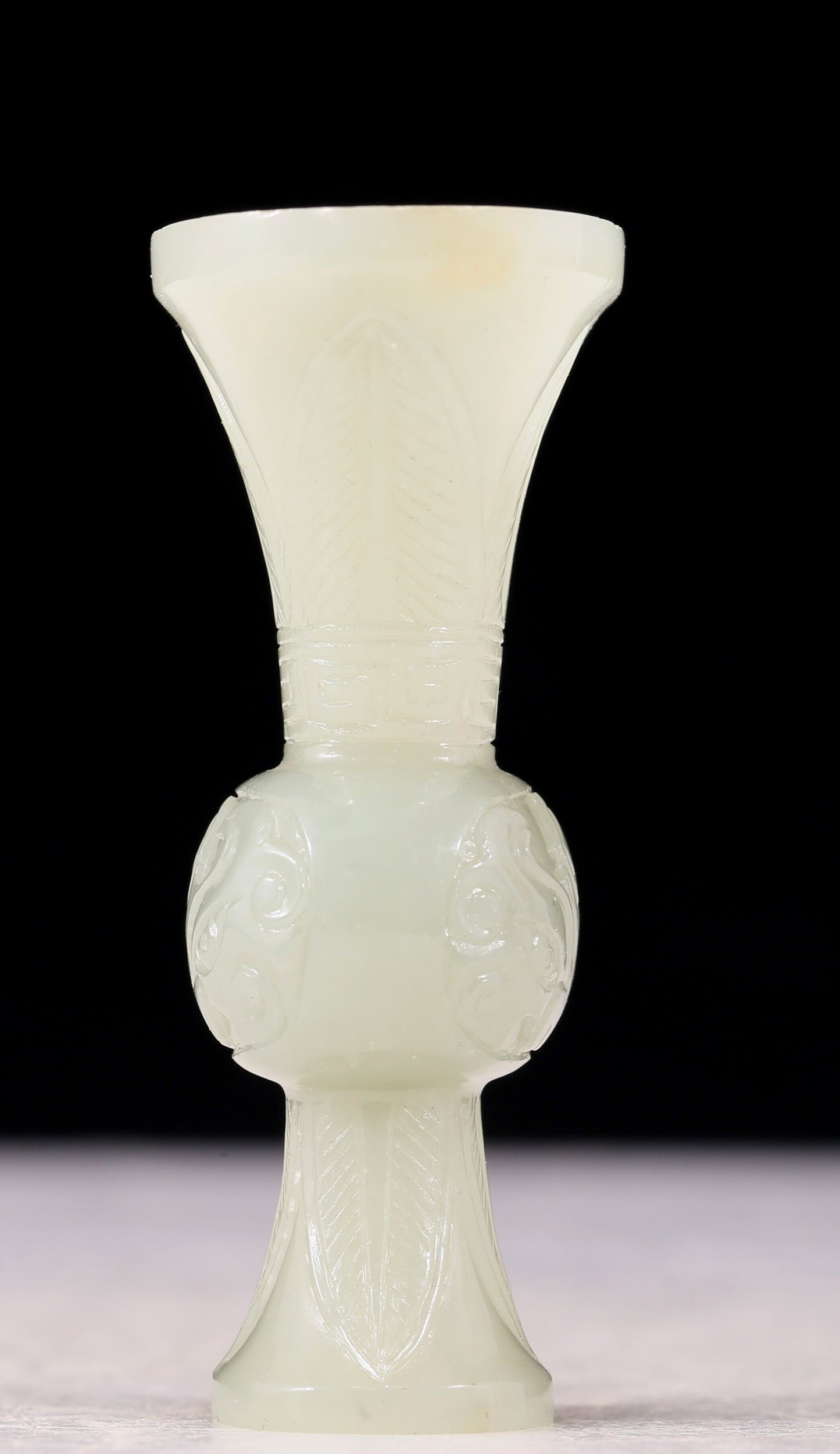 An exquisite white jade bottle with animal mask pattern