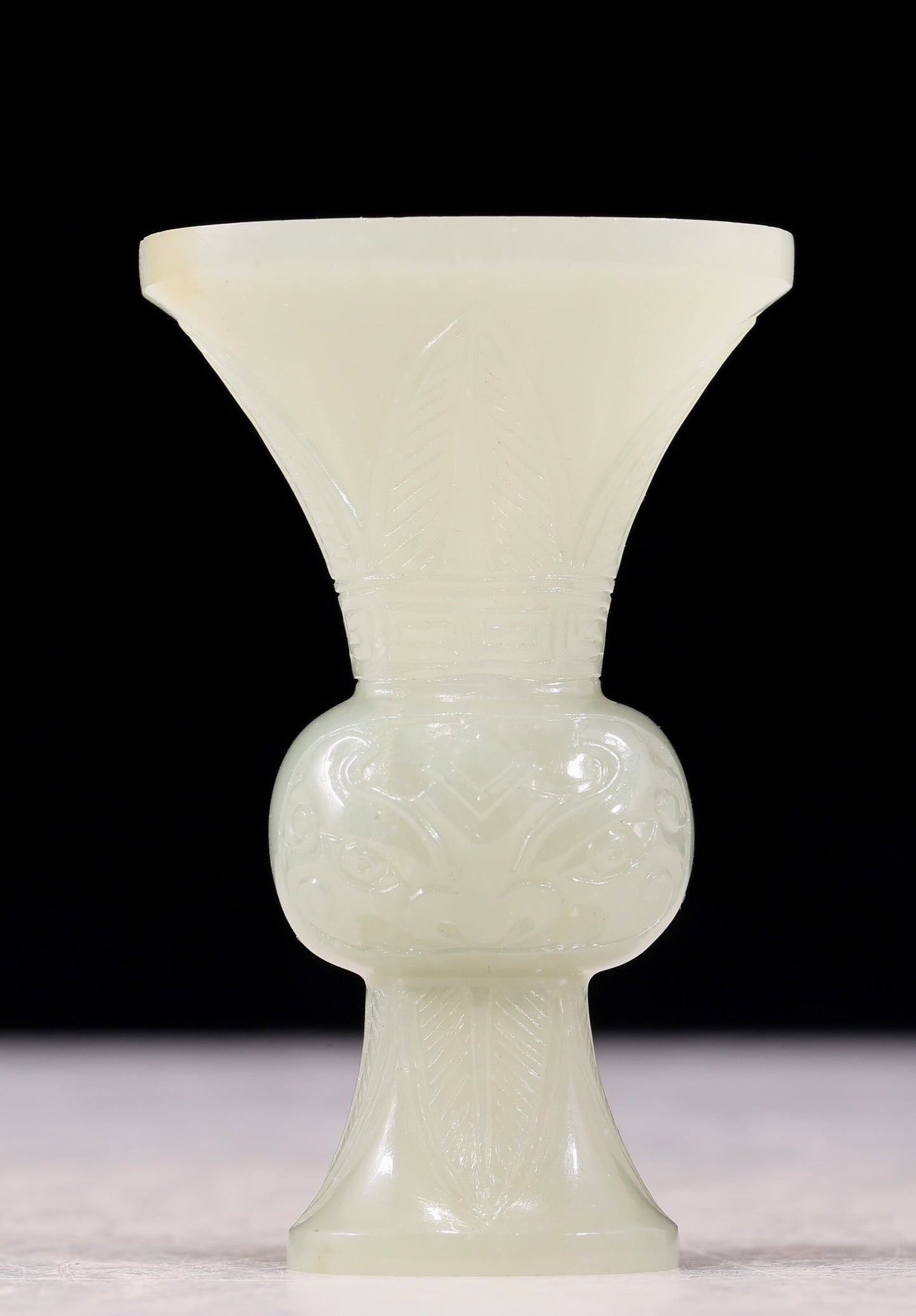 An exquisite white jade bottle with animal mask pattern