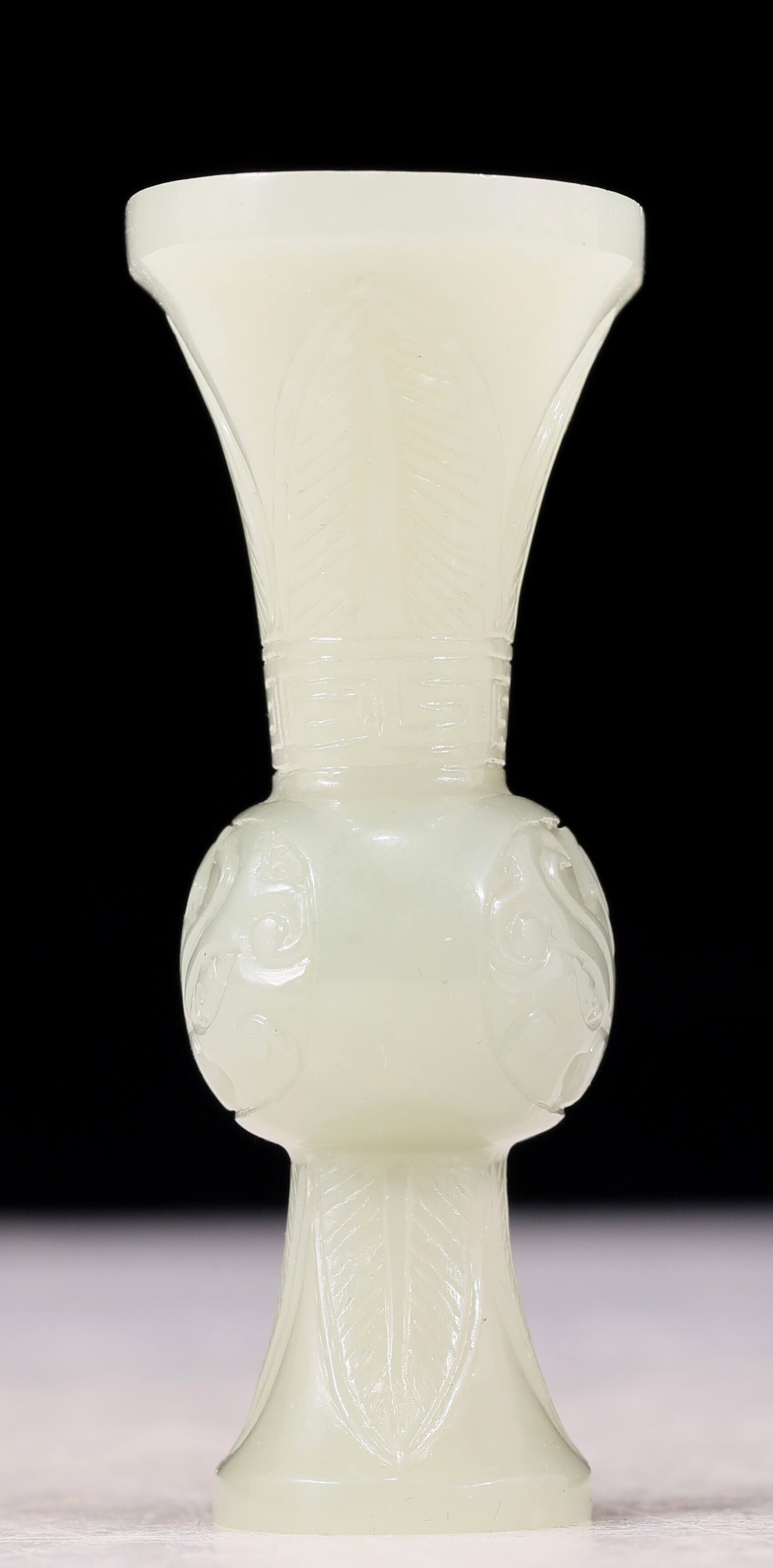 An exquisite white jade bottle with animal mask pattern