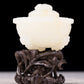 An exquisite white jade tripod censer with flower and bird patterns and lid