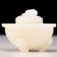 An exquisite white jade tripod censer with flower and bird patterns and lid