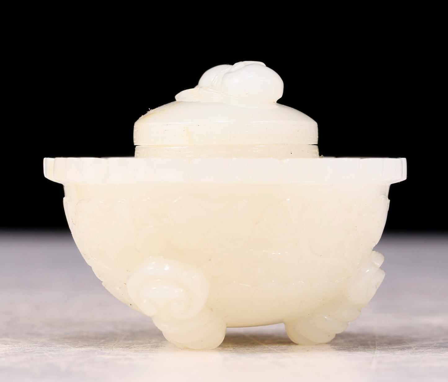 An exquisite white jade tripod censer with flower and bird patterns and lid