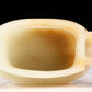 An exquisite white jade four-legged censer with dragon pattern and lid