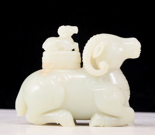 An exquisite white jade sheep-shaped bottle with lid