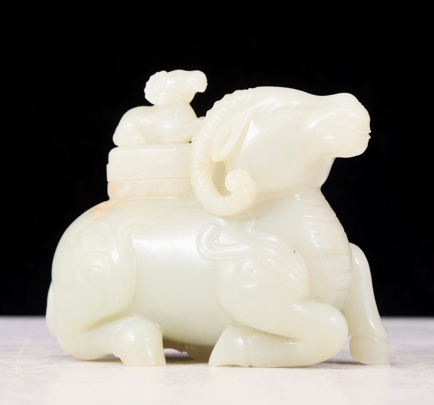 An exquisite white jade sheep-shaped bottle with lid