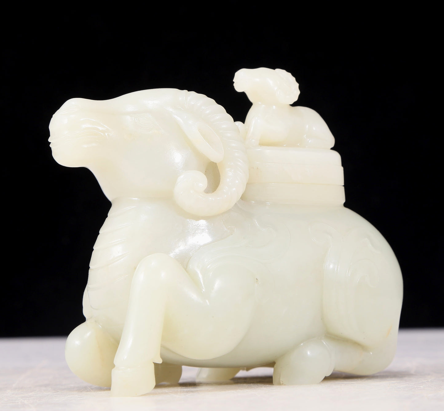 An exquisite white jade sheep-shaped bottle with lid