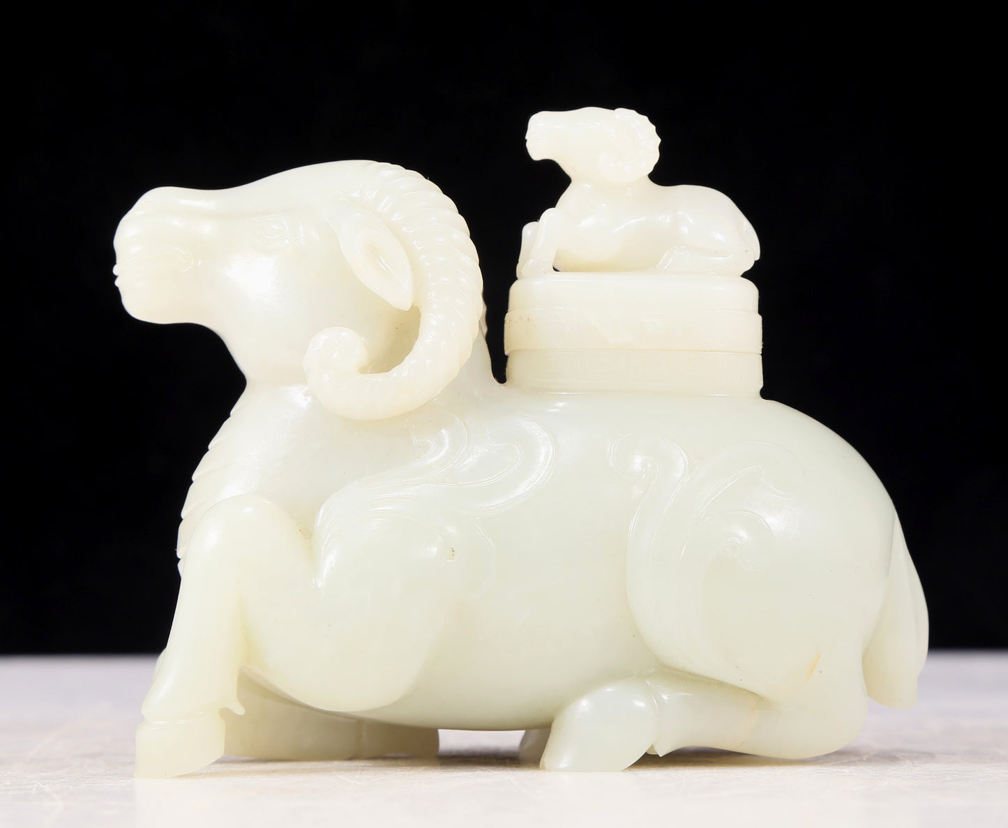 An exquisite white jade sheep-shaped bottle with lid