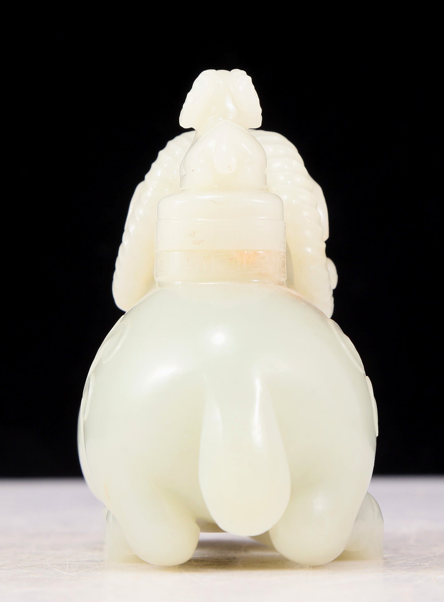 An exquisite white jade sheep-shaped bottle with lid