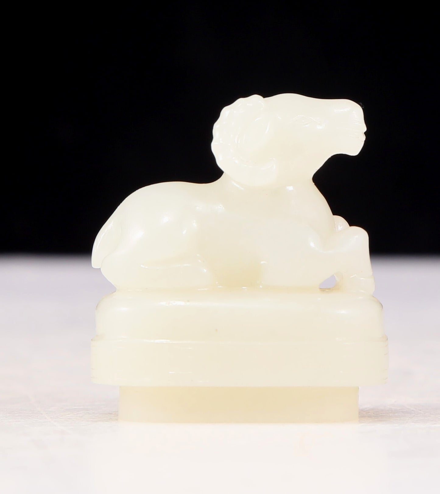 An exquisite white jade sheep-shaped bottle with lid