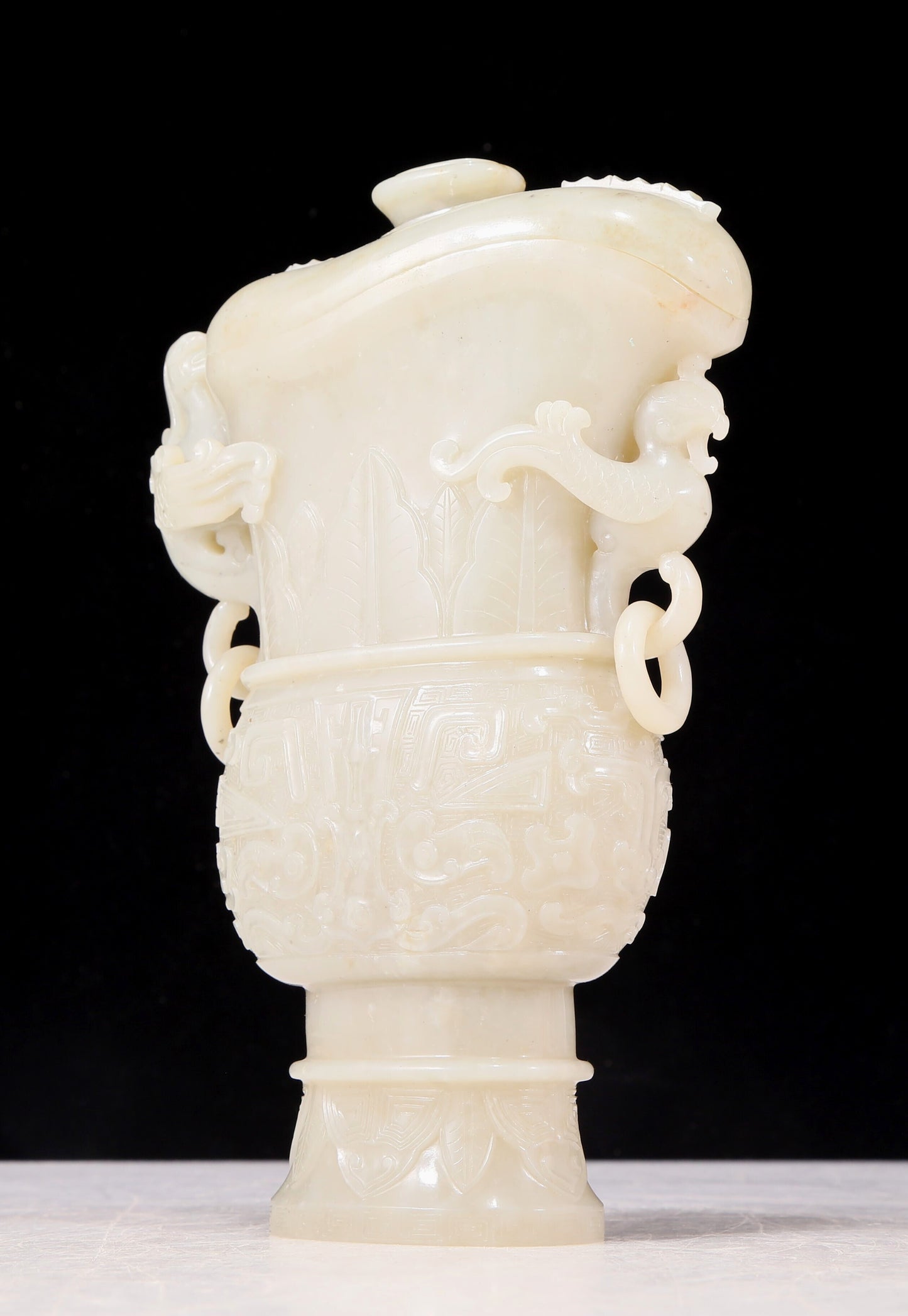 An exquisite white jade animal-faced dragon and phoenix ear bottle with lid