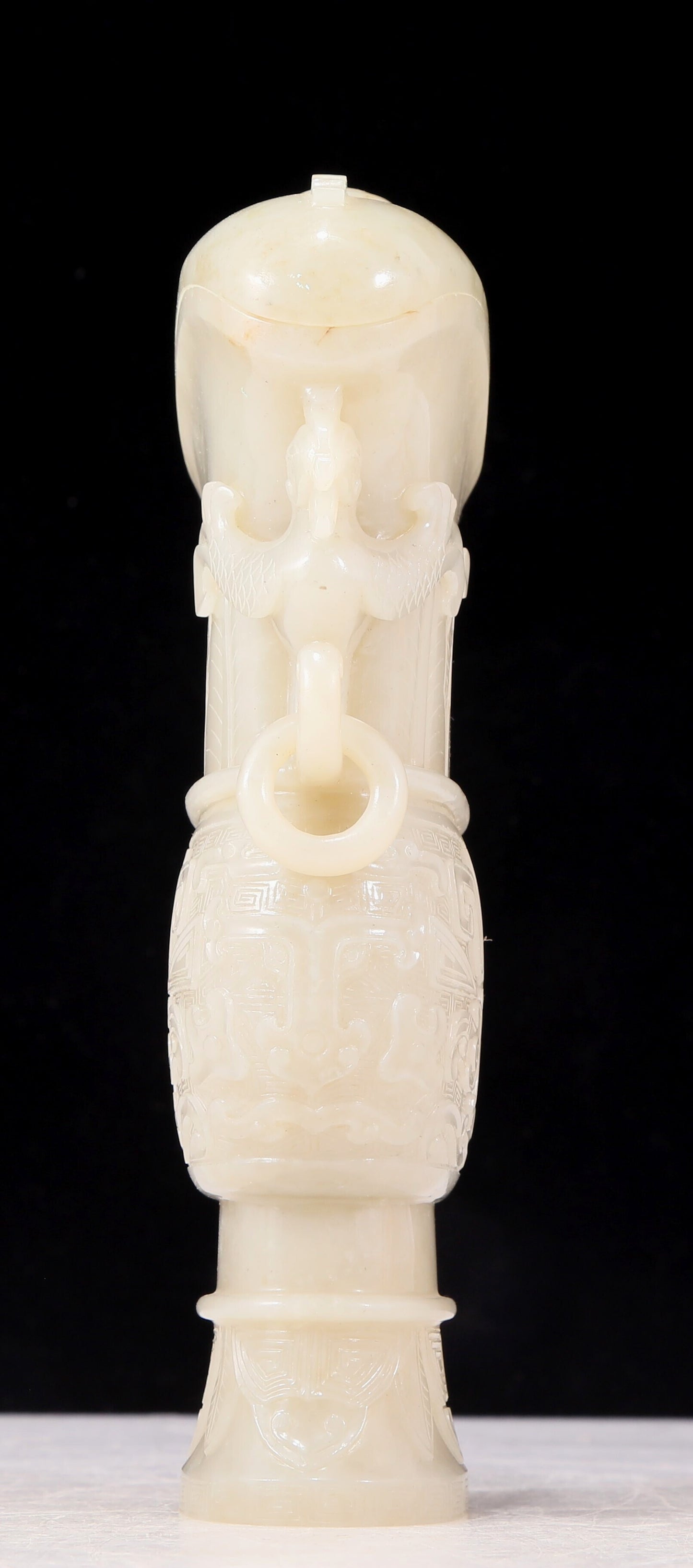 An exquisite white jade animal-faced dragon and phoenix ear bottle with lid