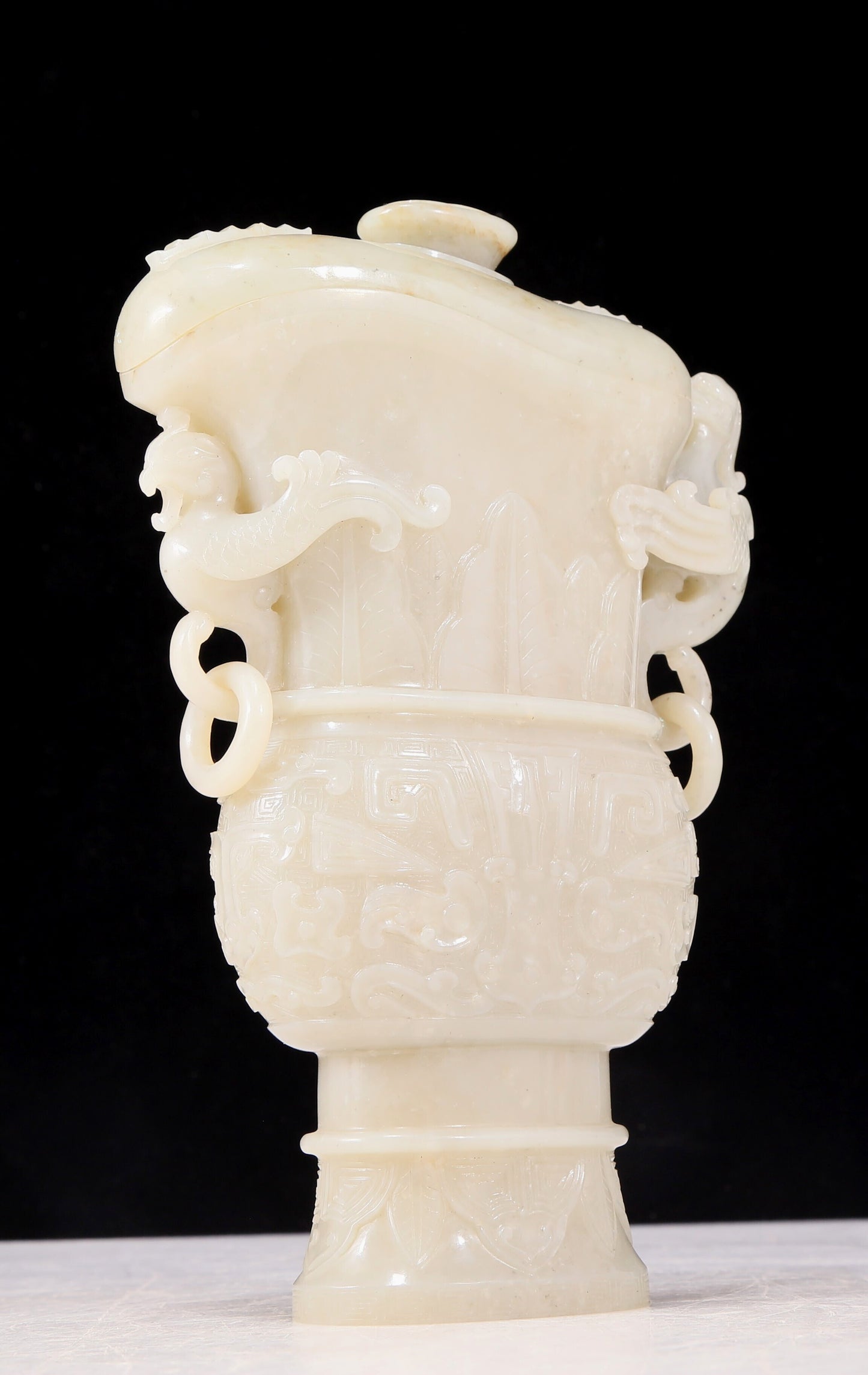 An exquisite white jade animal-faced dragon and phoenix ear bottle with lid