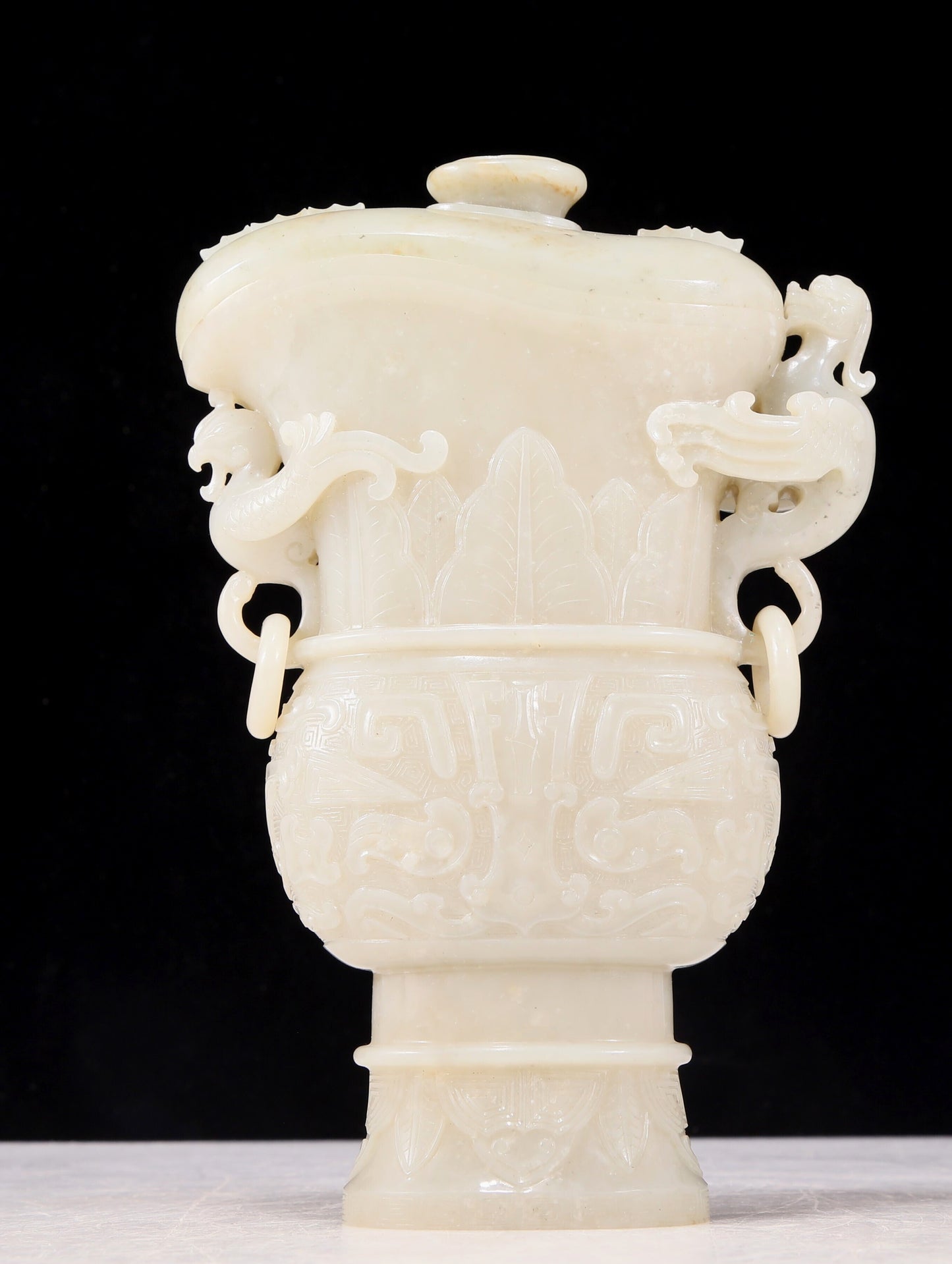 An exquisite white jade animal-faced dragon and phoenix ear bottle with lid