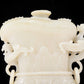 An exquisite white jade animal-faced dragon and phoenix ear bottle with lid