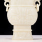 An exquisite white jade animal-faced dragon and phoenix ear bottle with lid