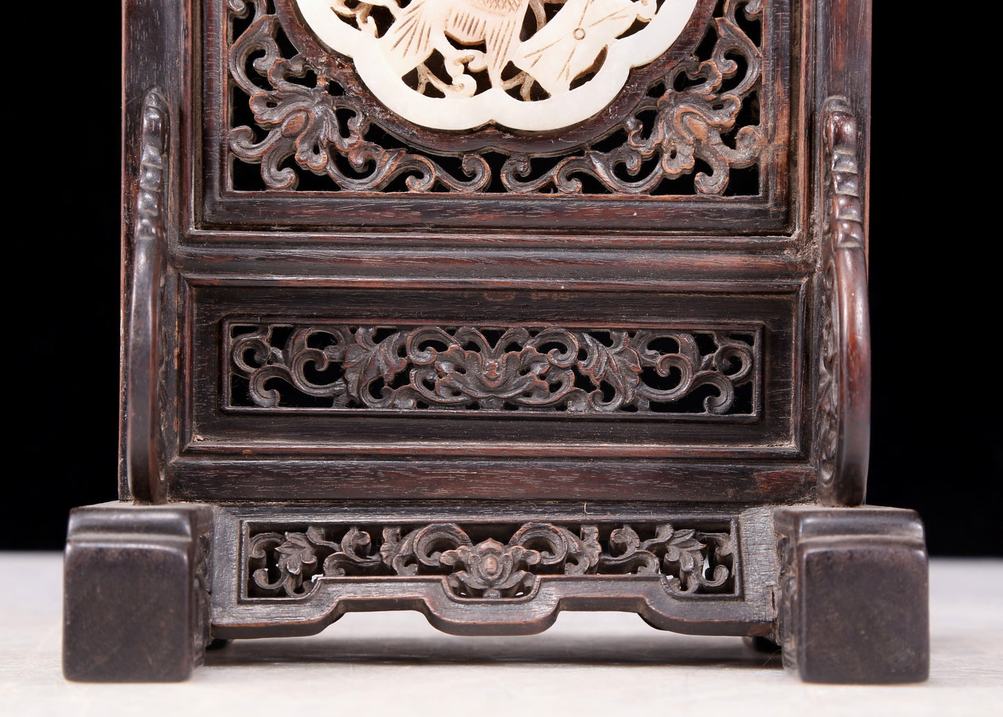 An exquisite zitanwood inlaid with white jade hollow carved flower and bird pattern table screen