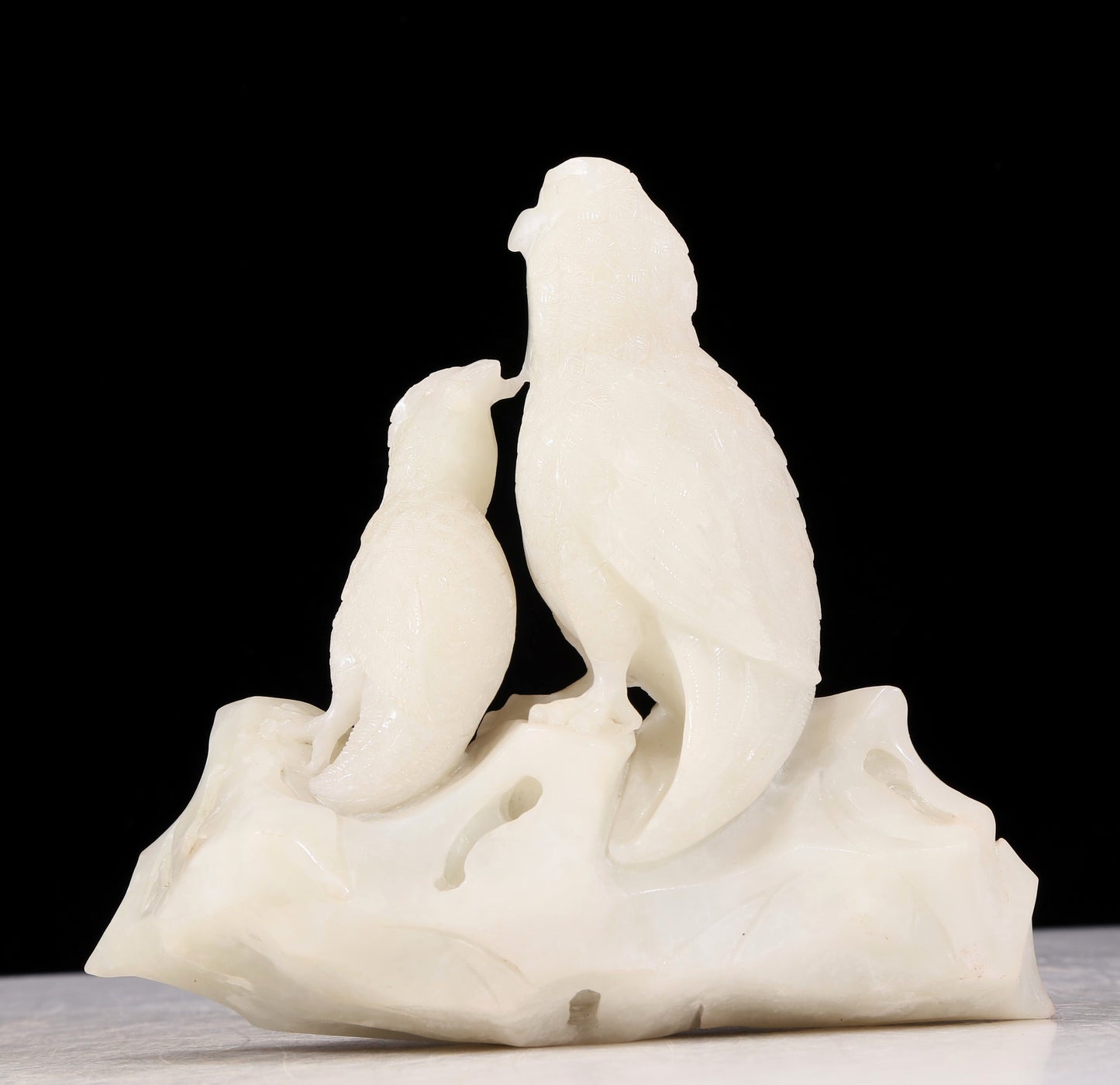 An exquisite white jade bird ornament