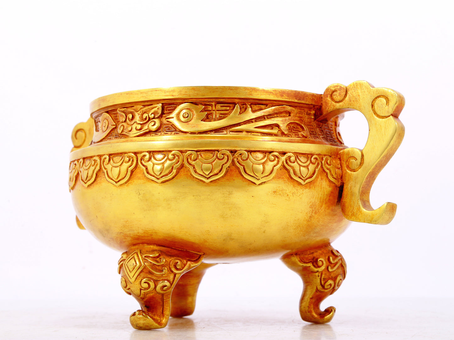 An exquisite gilt bronze censer with double ears and three legs