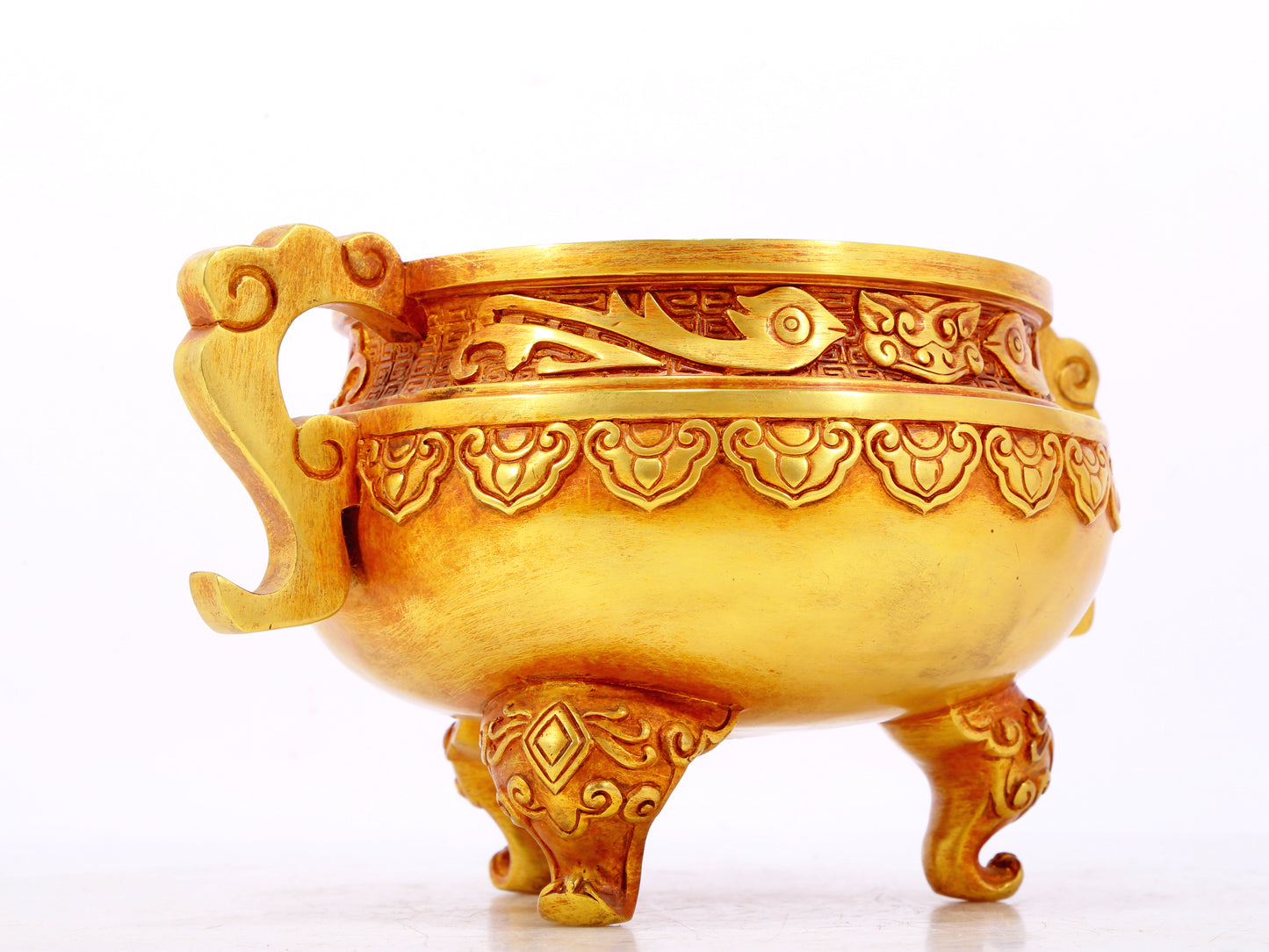 An exquisite gilt bronze censer with double ears and three legs